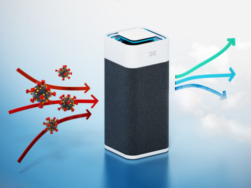 A black and white air purifier blocking virus particles on the left and releasing clean air on the right, illustrated with red arrows entering and blue arrows exiting the device.