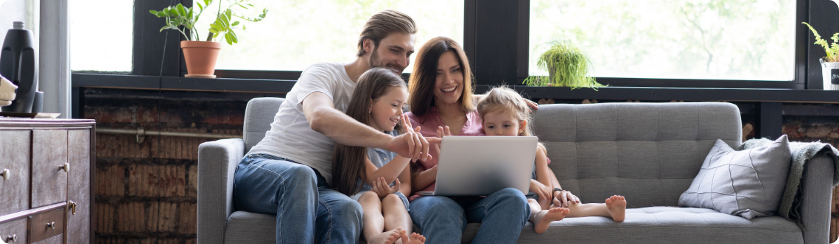 Family looking at financing options on their laptop