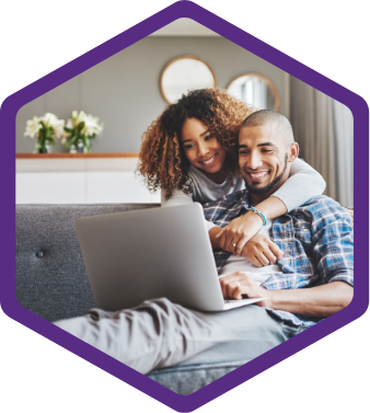 couple looking at their laptop at bumble breezes family plan